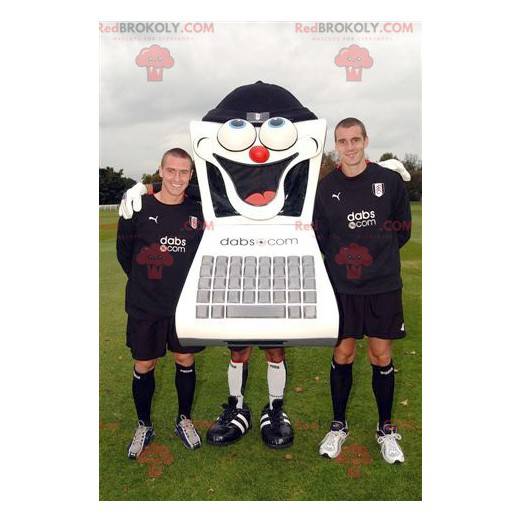 Black and white computer mascot with its keyboard -