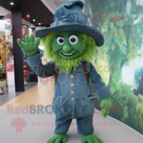 Forest Green Witch mascot costume character dressed with a Denim Shirt and Caps