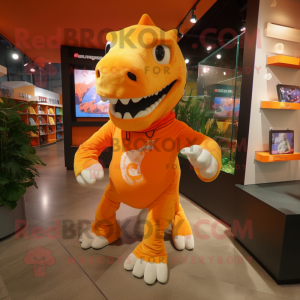 Orange Tyrannosaurus mascot costume character dressed with a Running Shorts and Messenger bags