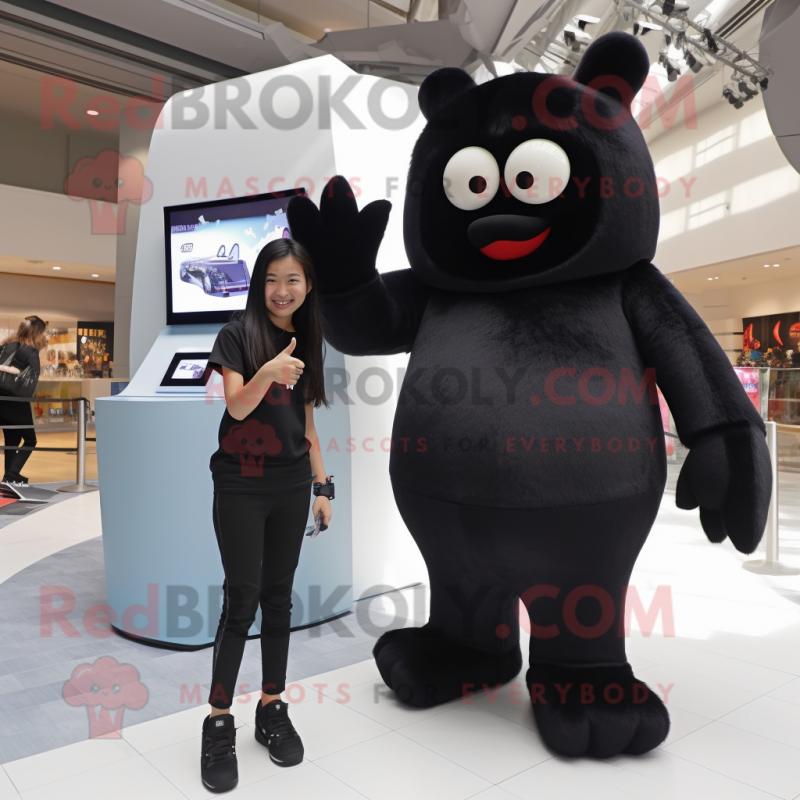 Black Ice mascot costume character dressed with a Jeggings and Watches Black Ice mascot costume character dressed with a Jeggings and Watches
