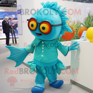 Turquoise Goldfish mascot costume character dressed with a Graphic Tee and Eyeglasses