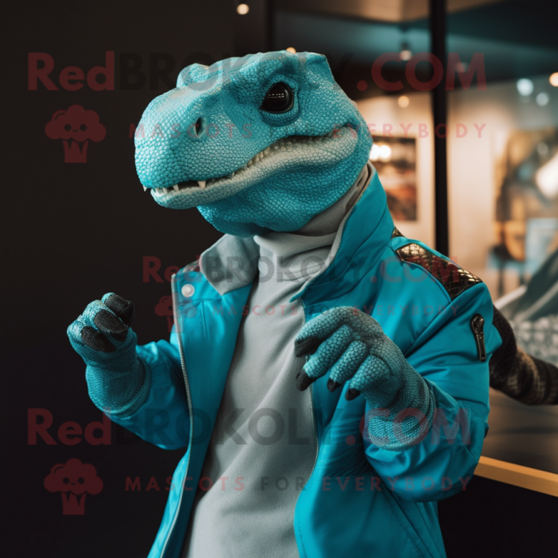 Turquoise Komodo Dragon mascot costume character dressed with a Jacket and Earrings Turquoise Komodo Dragon mascot costume character dressed with a Jacket and Earrings