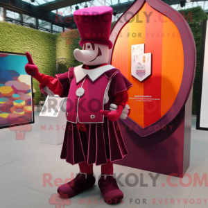 Maskotfigur av en magenta...