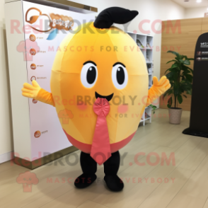 Peach Mango mascot costume character dressed with a Capri Pants and Ties