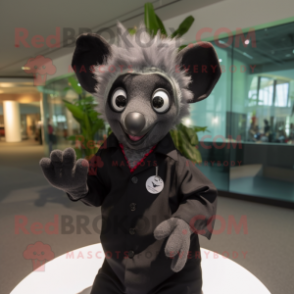 Black Aye-Aye mascot costume character dressed with a Button-Up Shirt and Cufflinks