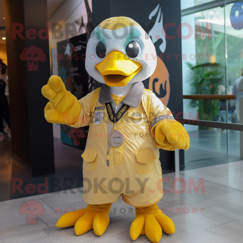 Gold Albatross mascot costume character dressed with a Overalls and Keychains