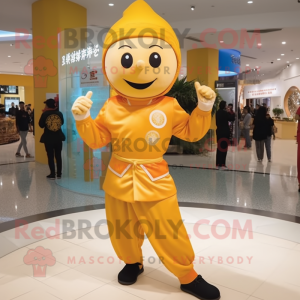Gold Mandarin mascot costume character dressed with a Joggers and Berets
