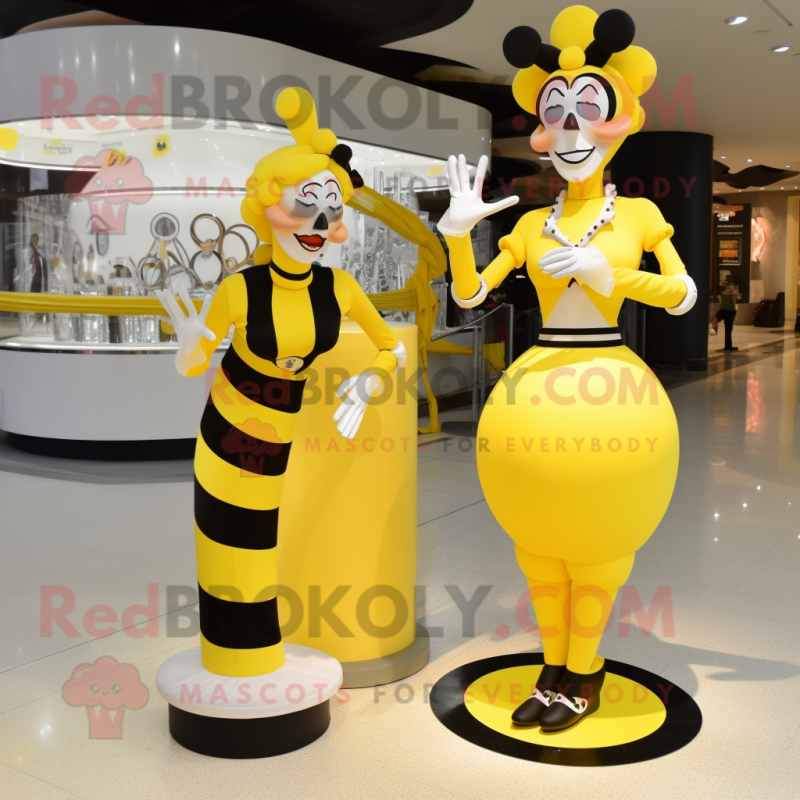 Yellow Mime mascot costume character dressed with a Evening Gown and Rings Yellow Mime mascot costume character dressed with a Evening Gown and Rings