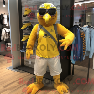 Maskotfigur af en gul høg...
