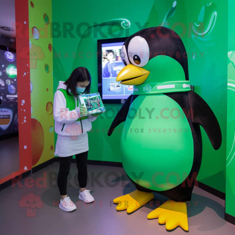 Green Penguin mascot costume character dressed with a T-Shirt and Smartwatches Green Penguin mascot costume character dressed with a T-Shirt and Smartwatches