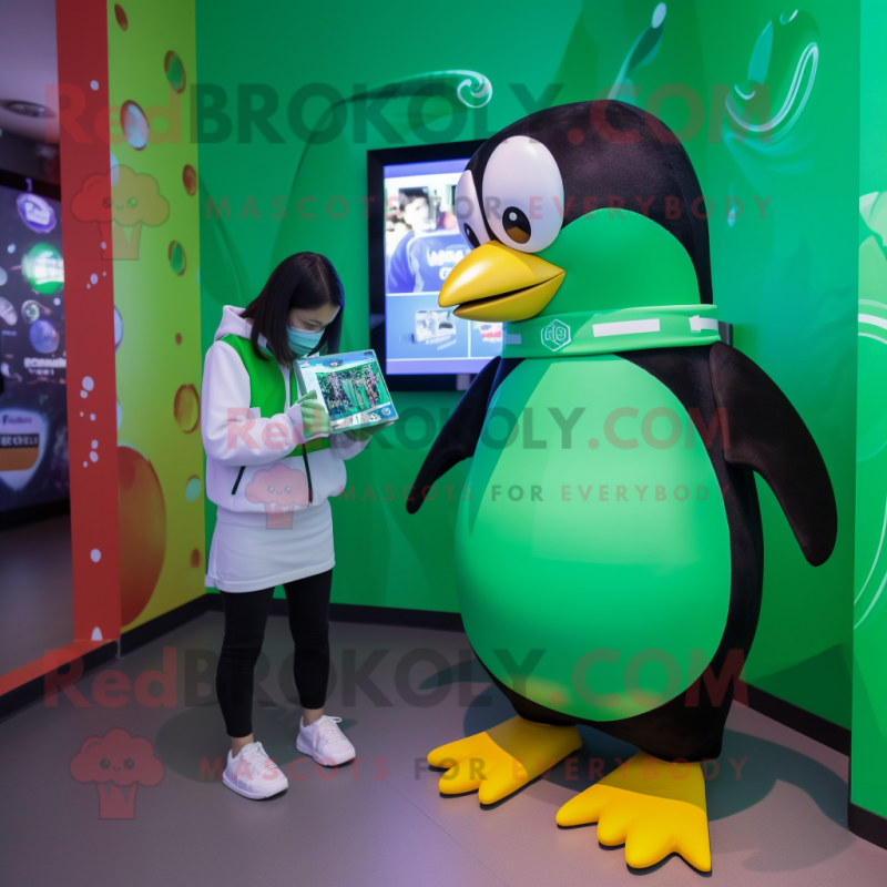 Green Penguin mascot costume character dressed with a T-Shirt and Smartwatches