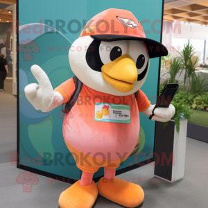 Peach Toucan mascot costume character dressed with a Overalls and Beanies