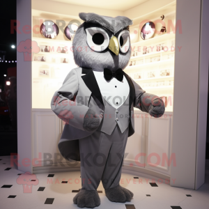 Gray Owl mascot costume character dressed with a Tuxedo and Cummerbunds