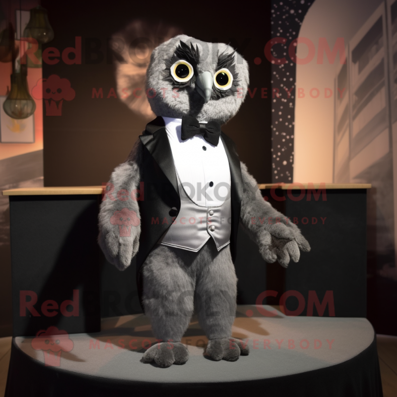 Gray Owl mascot costume character dressed with a Tuxedo and Cummerbunds