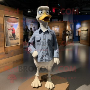 Silver Goose mascot costume character dressed with a Chambray Shirt and Lapel pins