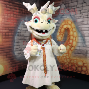 Cream Dragon mascot costume character dressed with a Blouse and Brooches