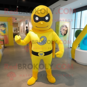 Yellow Superhero mascot costume character dressed with a Rash Guard and Tie pins