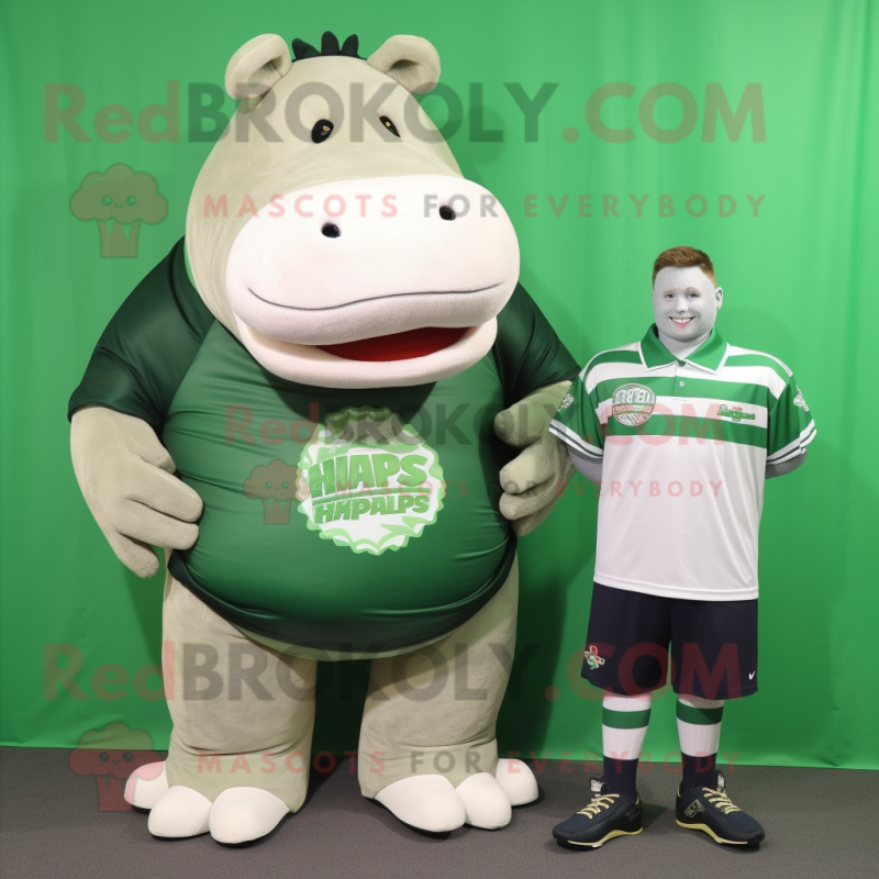 Forest Green Hippopotamus mascot costume character dressed with a Rugby Shirt and Shoe clips