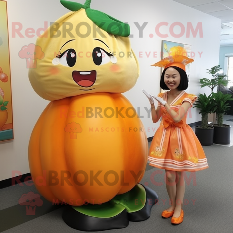 Peach Mandarin mascot costume character dressed with a Pencil Skirt and Shoe clips Peach Mandarin mascot costume character dressed with a Pencil Skirt and Shoe clips