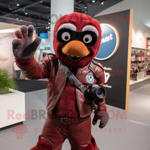 Maroon Camera mascot costume character dressed with a Leather Jacket and Gloves