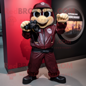 Maroon Camera mascot costume character dressed with a Leather Jacket and Gloves