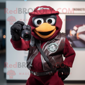 Maroon Camera mascot costume character dressed with a Leather Jacket and Gloves