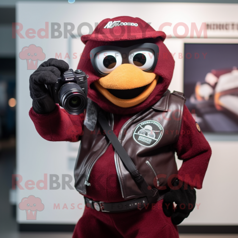 Maroon Camera mascot costume character dressed with a Leather Jacket and Gloves Maroon Camera mascot costume character dressed with a Leather Jacket and Gloves