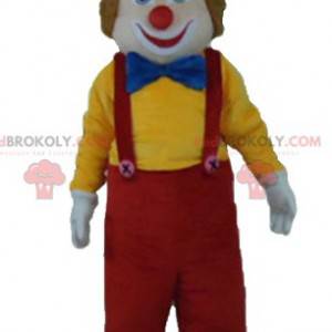 Mascotte de clown multicolore souriant et mignon -