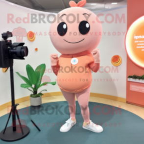 Peach Camera mascot costume character dressed with a Yoga Pants and Lapel pins