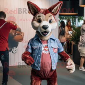 Maroon Dingo mascot costume character dressed with a Denim Shirt and Brooches