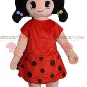 Mascot chica morena vestida con un vestido rojo con lunares -