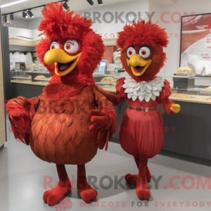 Maskot karakter af en rød...
