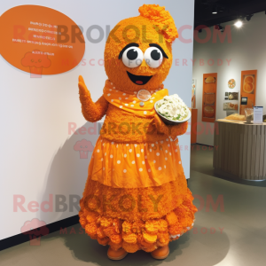 Orange Biryani mascot costume character dressed with a Empire Waist Dress and Brooches