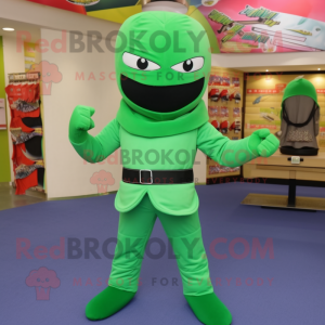 Green Ninja mascot costume character dressed with a Flare Jeans and Shoe clips