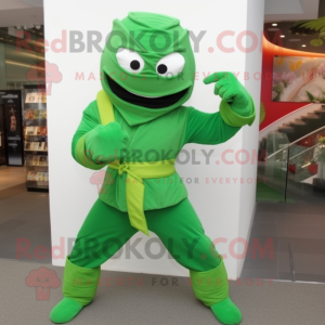 Green Ninja mascot costume character dressed with a Flare Jeans and Shoe clips