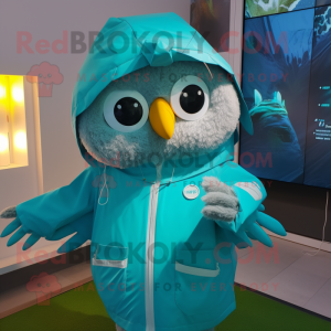 Turquoise Owl mascot costume character dressed with a Raincoat and Smartwatches