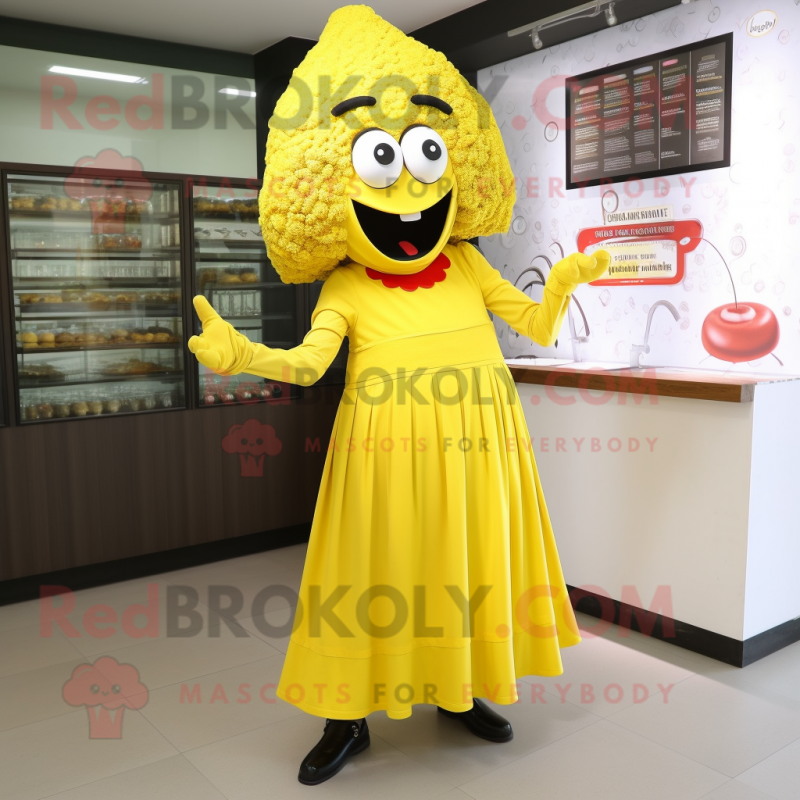 Yellow Paella mascot costume character dressed with a Empire Waist Dress and Shoe laces