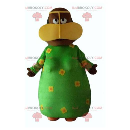 Afrikansk kvinnamaskot med en grön blommig klänning -