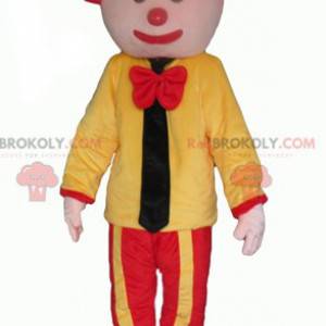 Mascotte de clown jaune et rouge avec une cravate -