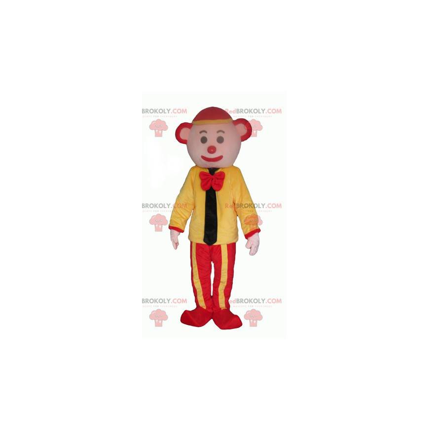 Gelbes und rotes Clownmaskottchen mit einer Krawatte -