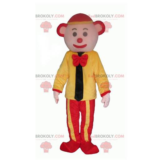 Gelbes und rotes Clownmaskottchen mit einer Krawatte -