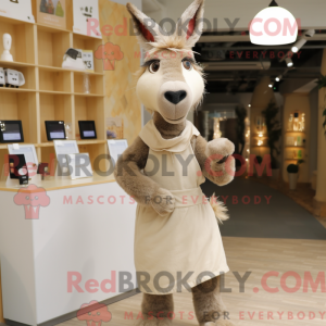 Maskotkarakter av et beżowy...