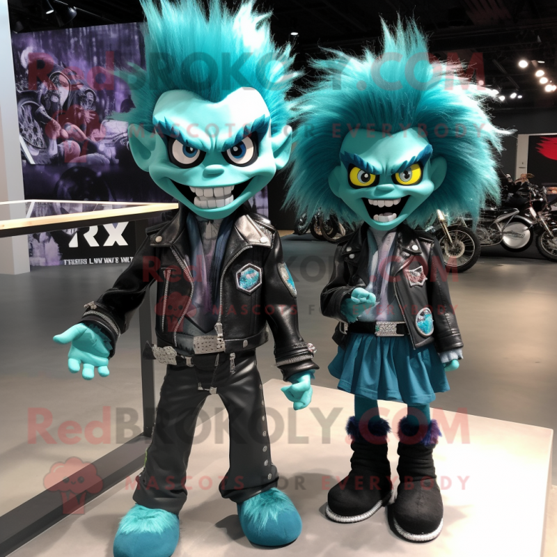 Teal Vampire mascot costume character dressed with a Moto Jacket and Hair clips Teal Vampire mascot costume character dressed with a Moto Jacket and Hair clips