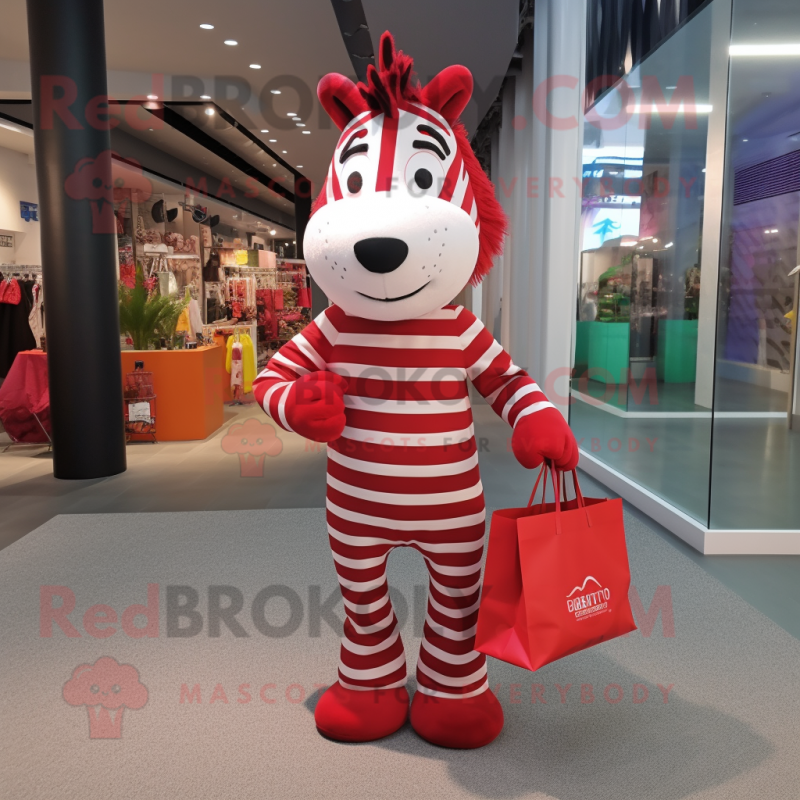 Red Zebra mascot costume character dressed with a Dress Pants and Tote bags