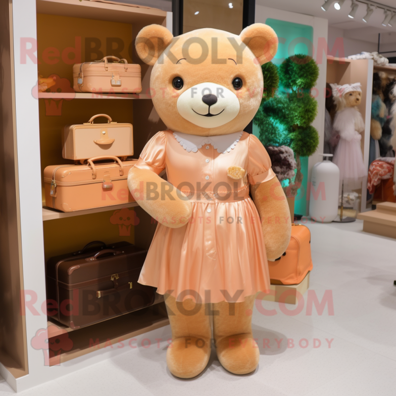 Peach Teddy Bear mascot costume character dressed with a Dress and Handbags Peach Teddy Bear mascot costume character dressed with a Dress and Handbags