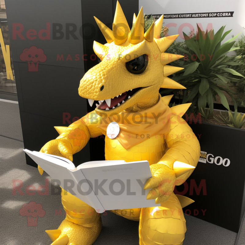 Gold Stegosaurus mascot costume character dressed with a Cover-up and Reading glasses Gold Stegosaurus mascot costume character dressed with a Cover-up and Reading glasses