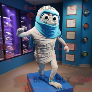 Maskotfigur af en blå mumie...