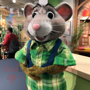 Green Ratatouille mascot costume character dressed with a Flannel Shirt and Brooches