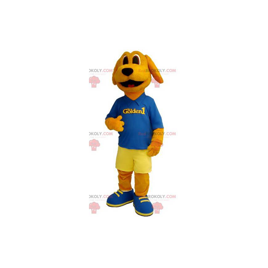 Mascotte de chien orange habillé en bleu et jaune -