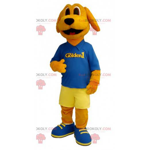 Mascotte de chien orange habillé en bleu et jaune -